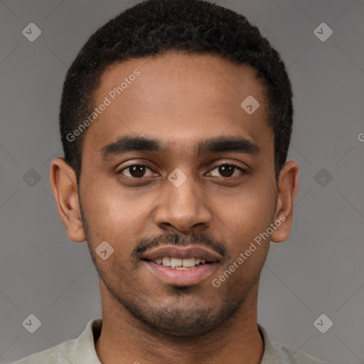 Joyful black young-adult male with short  black hair and brown eyes