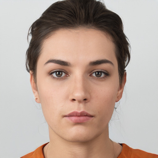 Neutral white young-adult female with short  brown hair and brown eyes