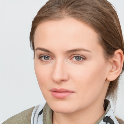 Neutral white young-adult female with medium  brown hair and grey eyes