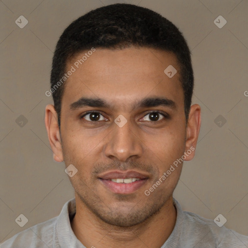 Joyful black young-adult male with short  brown hair and brown eyes