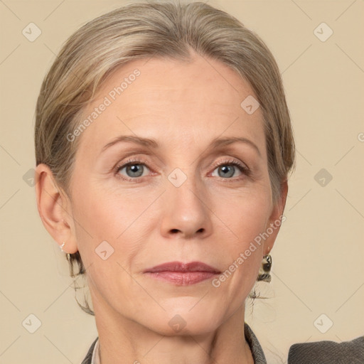 Joyful white adult female with medium  brown hair and grey eyes