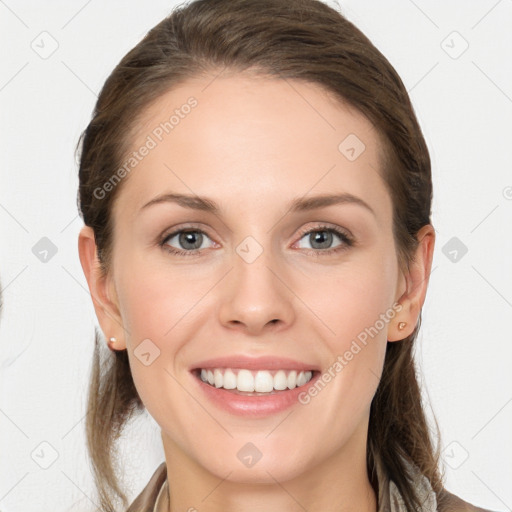 Joyful white young-adult female with long  brown hair and grey eyes