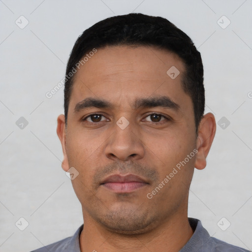 Neutral latino young-adult male with short  black hair and brown eyes