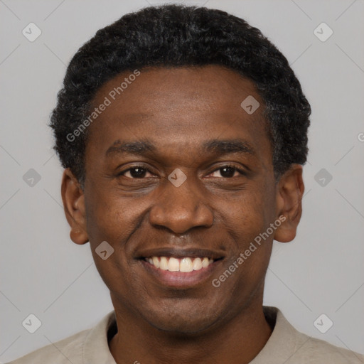 Joyful black young-adult male with short  black hair and brown eyes