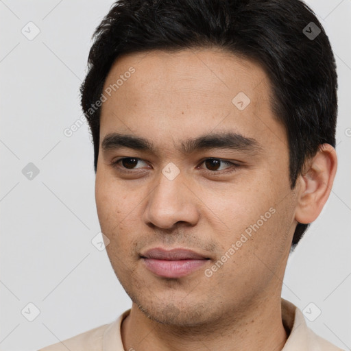 Joyful latino young-adult male with short  brown hair and brown eyes