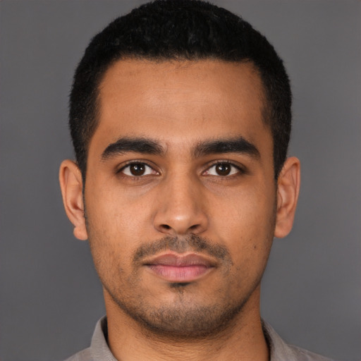 Neutral latino young-adult male with short  black hair and brown eyes