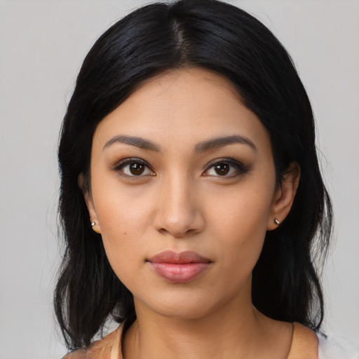 Neutral latino young-adult female with long  black hair and brown eyes