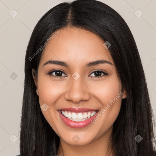 Joyful latino young-adult female with long  black hair and brown eyes