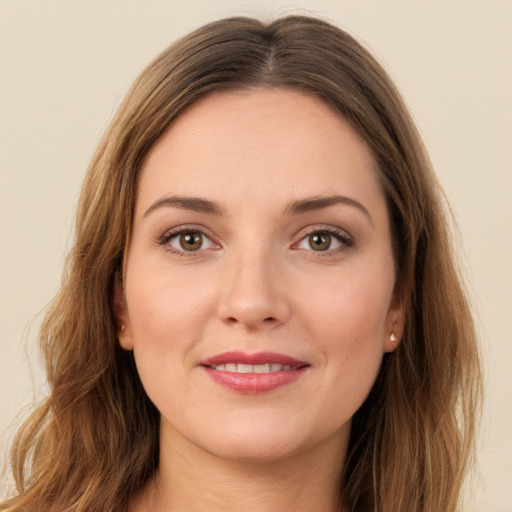 Joyful white young-adult female with long  brown hair and brown eyes