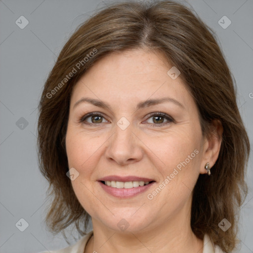 Joyful white adult female with medium  brown hair and brown eyes