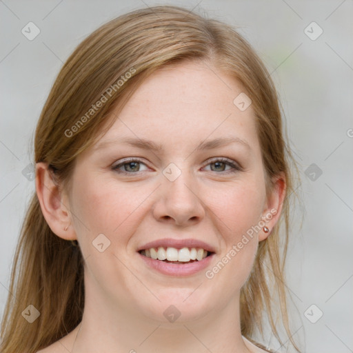 Joyful white young-adult female with medium  brown hair and blue eyes