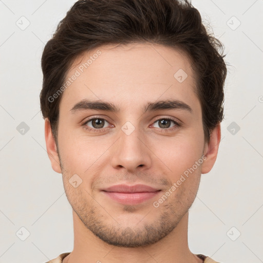 Joyful white young-adult male with short  brown hair and brown eyes