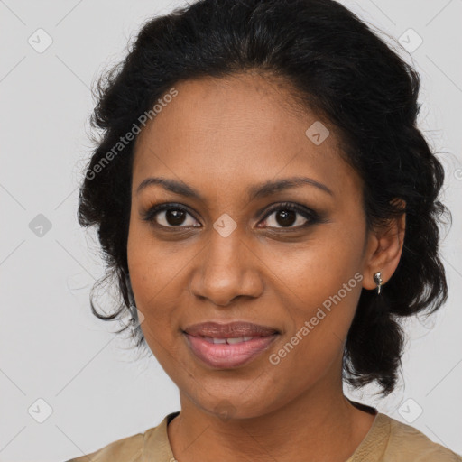 Joyful black adult female with medium  brown hair and brown eyes