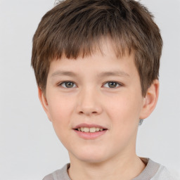 Joyful white child male with short  brown hair and brown eyes