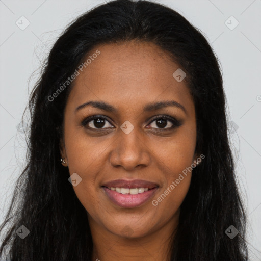 Joyful black young-adult female with long  brown hair and brown eyes