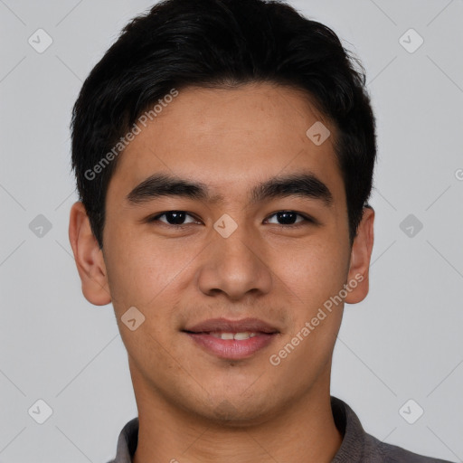 Joyful asian young-adult male with short  black hair and brown eyes