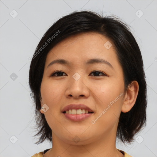 Joyful asian young-adult female with medium  brown hair and brown eyes