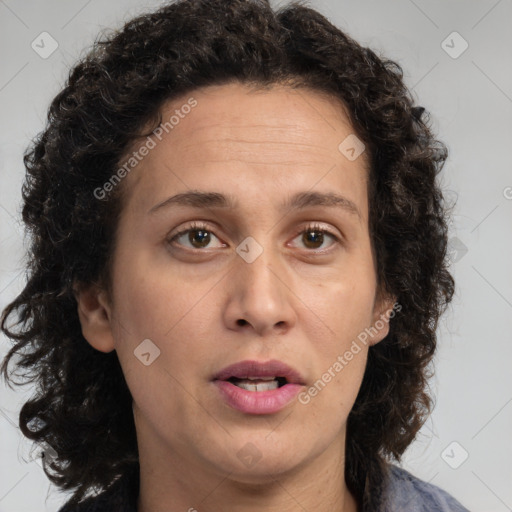 Joyful white adult female with long  brown hair and brown eyes