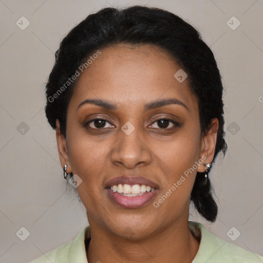 Joyful black young-adult female with short  black hair and brown eyes