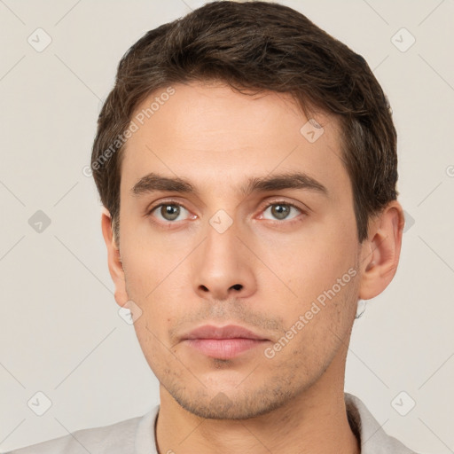 Neutral white young-adult male with short  brown hair and brown eyes