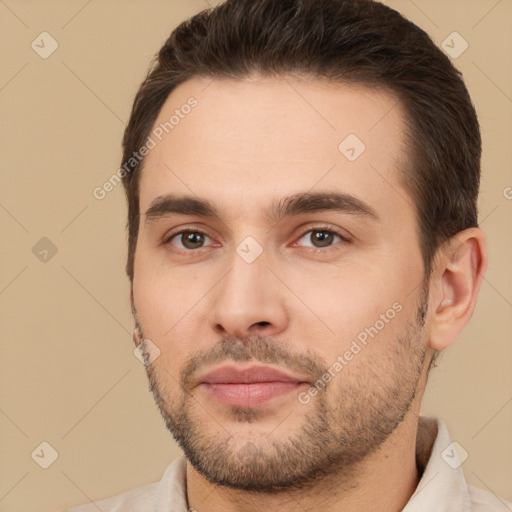 Joyful white young-adult male with short  brown hair and brown eyes