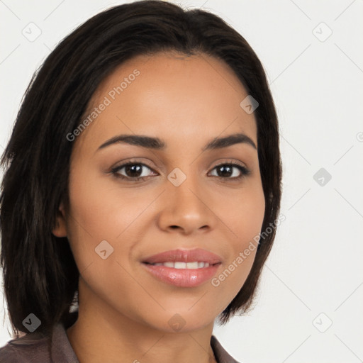 Joyful latino young-adult female with long  brown hair and brown eyes