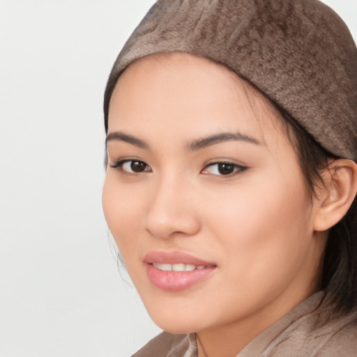 Joyful white young-adult female with long  black hair and brown eyes