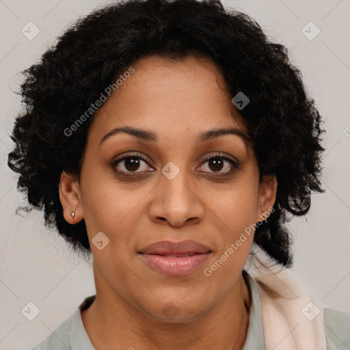 Joyful latino adult female with medium  brown hair and brown eyes