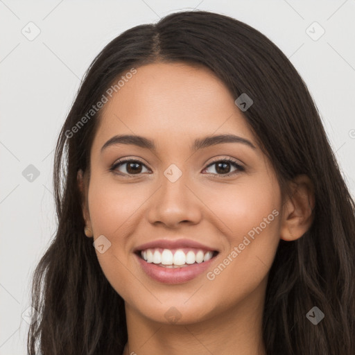 Joyful latino young-adult female with long  brown hair and brown eyes