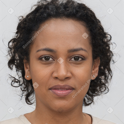 Joyful black young-adult female with medium  brown hair and brown eyes