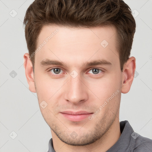 Neutral white young-adult male with short  brown hair and grey eyes