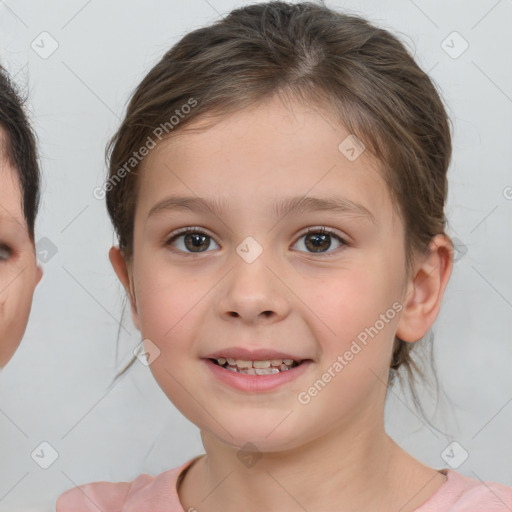 Joyful white child female with medium  brown hair and brown eyes