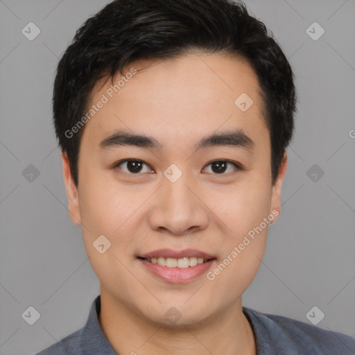 Joyful asian young-adult male with short  black hair and brown eyes