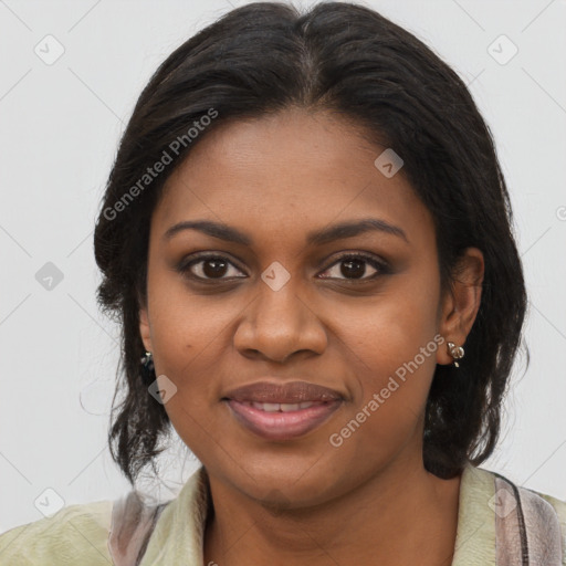 Joyful black young-adult female with long  brown hair and brown eyes