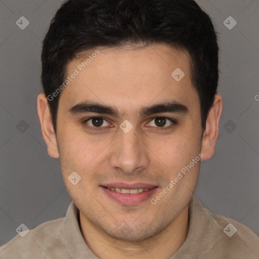 Joyful latino young-adult male with short  brown hair and brown eyes