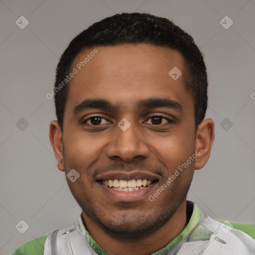 Joyful black young-adult male with short  black hair and brown eyes