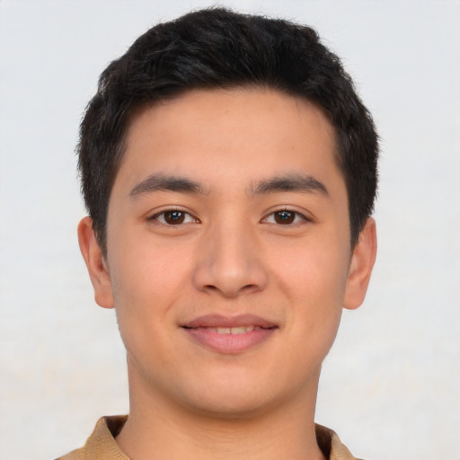 Joyful latino young-adult male with short  brown hair and brown eyes