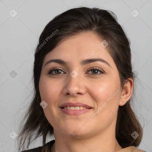 Joyful white young-adult female with medium  brown hair and brown eyes