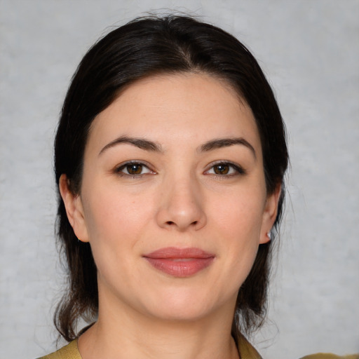 Joyful white young-adult female with medium  brown hair and brown eyes