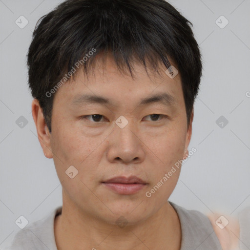 Neutral asian young-adult male with short  brown hair and brown eyes