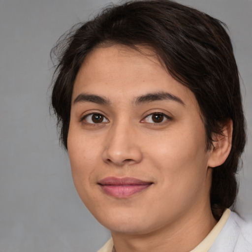 Joyful white young-adult female with medium  brown hair and brown eyes