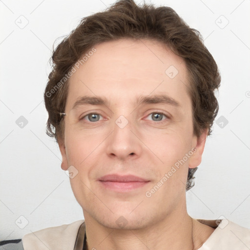 Joyful white adult male with short  brown hair and grey eyes