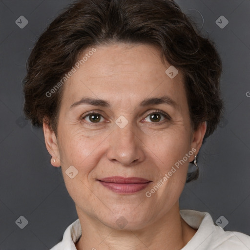 Joyful white adult female with short  brown hair and brown eyes