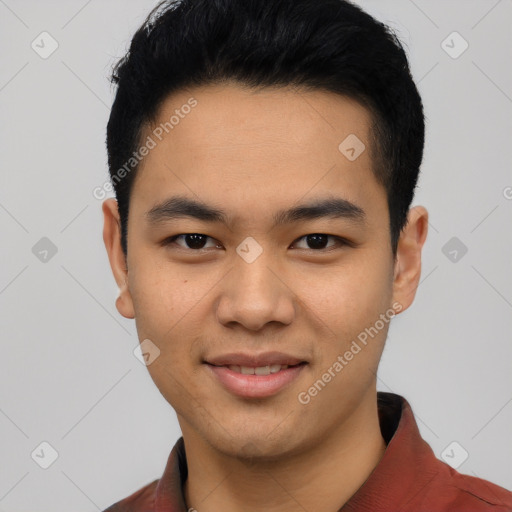 Joyful asian young-adult male with short  black hair and brown eyes