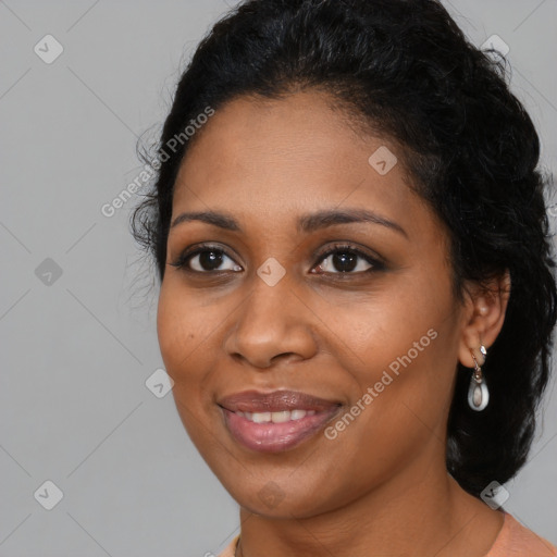 Joyful black young-adult female with medium  brown hair and brown eyes