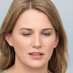 Joyful white young-adult female with long  brown hair and blue eyes