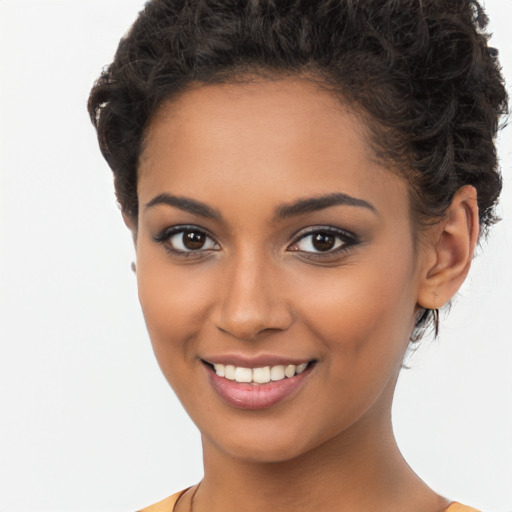 Joyful latino young-adult female with short  brown hair and brown eyes