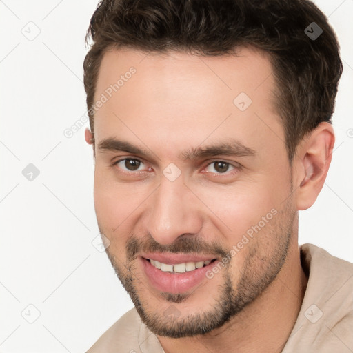 Joyful white young-adult male with short  brown hair and brown eyes