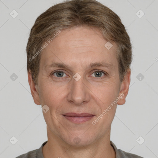 Joyful white adult male with short  brown hair and grey eyes