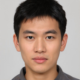 Neutral asian young-adult male with short  brown hair and brown eyes